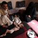 A family with a malnourished child is pictured in their home in Sanaa June 21, 2012. (Reuters/Mohamed al-Sayaghi)